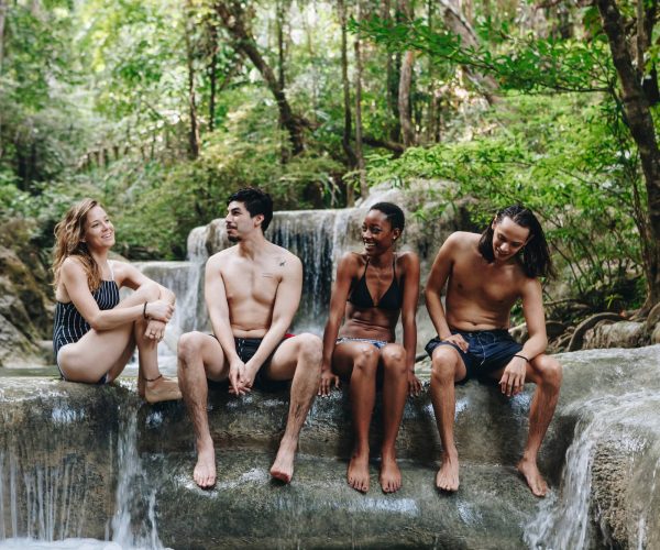 friends-enjoying-waterfall-in-tropical-forest-2026-03-18-13-48-25-utc (1)
